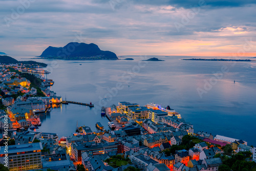 Colorful sunset in Alesund port town on western coast of Norway. Place where the ocean meet the mountains