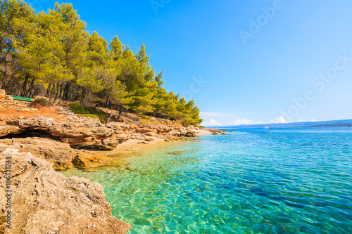 Azure blue sea water in small bay near Zlatni Rat beach in Bol, Brac island, Croatia