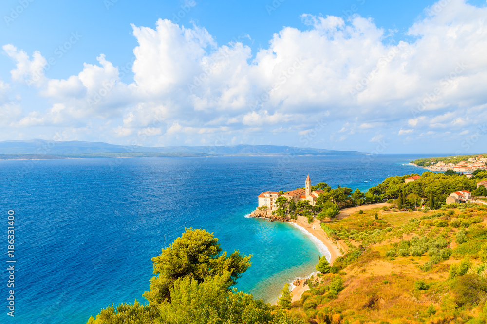 View of Dominican monastery in beautiful bay with beach, Bol town, Brac island, Croatia