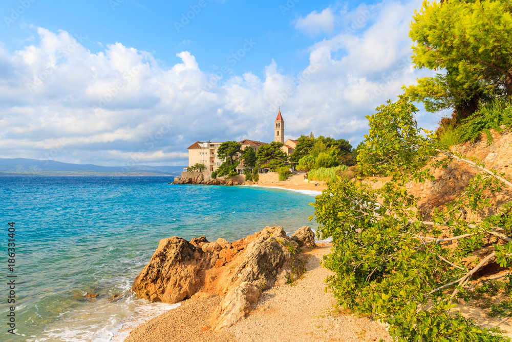 View of Dominican monastery in beautiful bay with beach, Bol town, Brac island, Croatia
