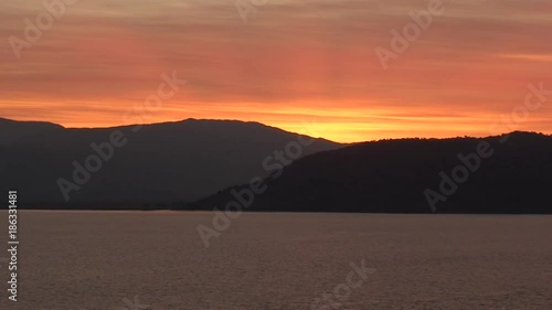 Corfu Island silhouette at sunset, wide