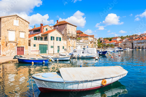 View of Milna port with colorful fishing boats and houses, Brac island, Croatia