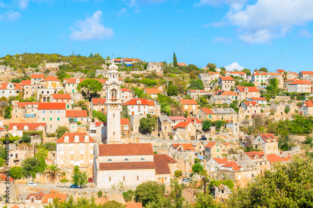Fototapeta premium View of Lozisca village with colorful houses and church, Brac island, Croatia