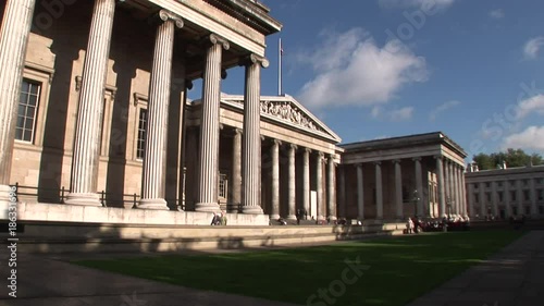 Low angle, people enter famous building in London