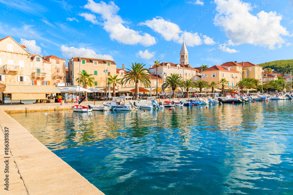 View of Supetar port with boats and colorful houses on Brac island, Croatia.