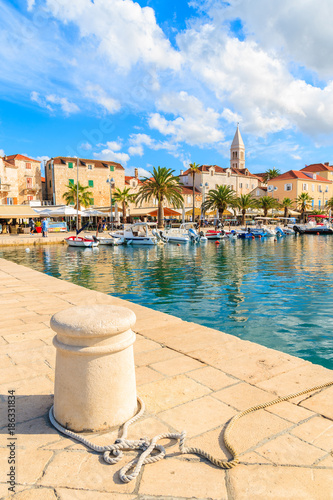 Pier in Supetar port with colorful houses and boats, Brac island, Croatia