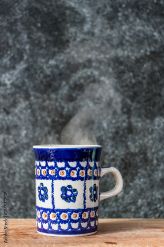 Blue mug on wooden surface