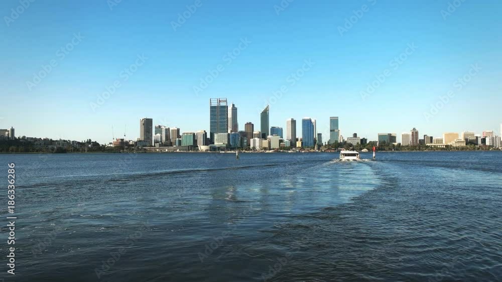 the mends street ferry on the swan river heads towards the city of perth in western australia the mends street ferry on the swan river heads towards the city of perth in western australia
