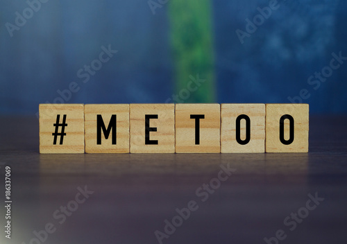 Me Too hashtag from wood cube letters, anti sexual harassment social media campaign