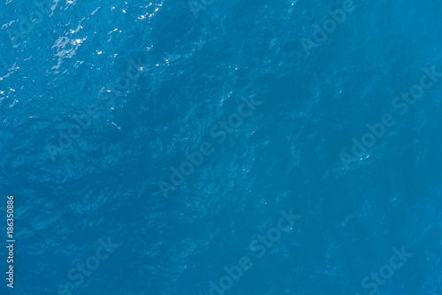 Aerial view on turquoise waves, water surface texture