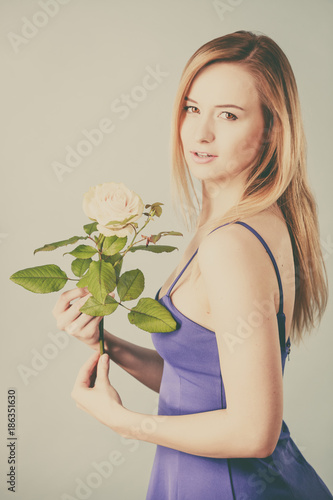 woman holding white rose