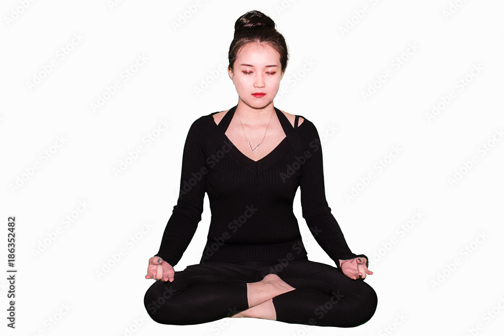 A young oriental girl is practicing yoga