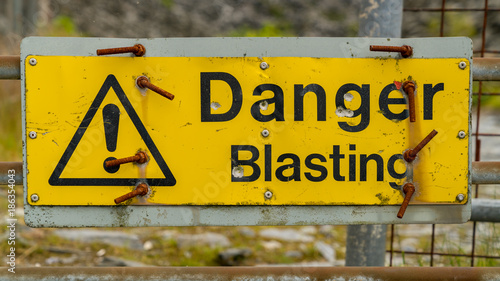Sign: Danger Blasting, seen at Maenofferen Slate Quarry in Blaenau Ffestiniog, Gwynedd, Wales, UK