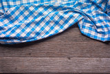 Blue Checkered Fabric on wood  Background.