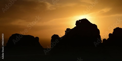 the sunset view of Yardang Landform (devil city) in Yumen Pass, Dunhuang, Gansu, China photo