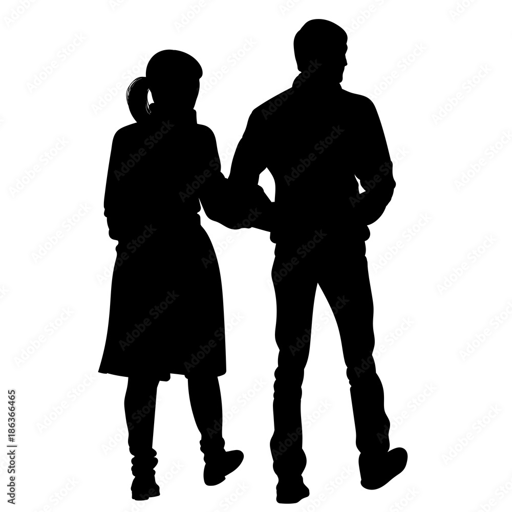 Silhouette of a girl and a young man walking