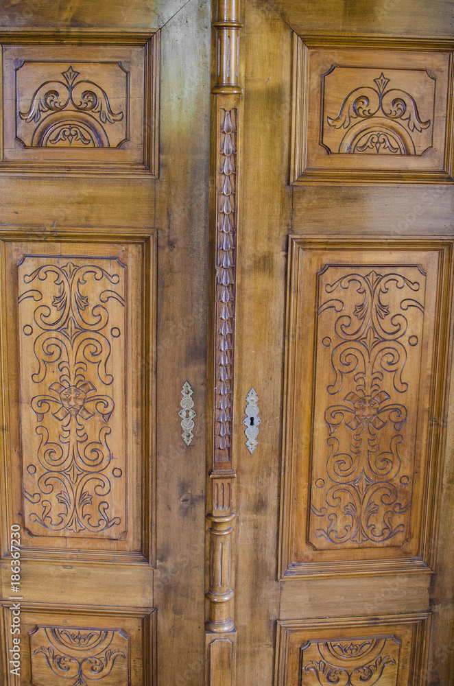 Wooden carved door on the cabinet