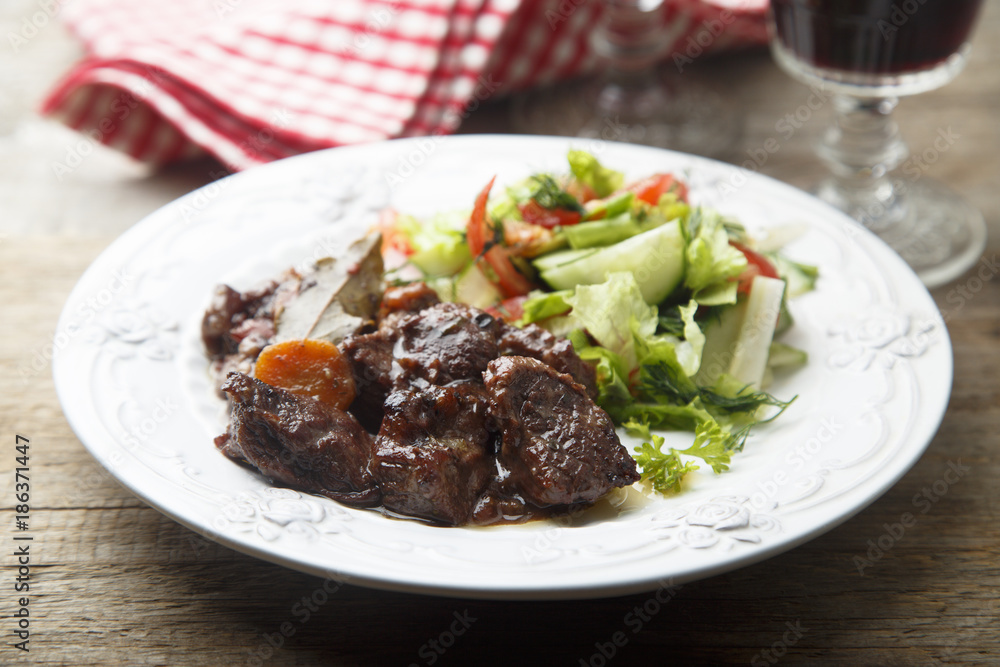 Beef stew with vegetables and red wine