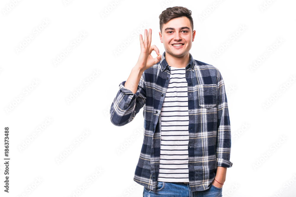 Picture of happy young man dressed isolated over white background showing okay gesture. Picture of happy young man dressed isolated over white background showing okay gesture.