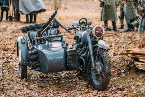 Fototapeta Naklejka Na Ścianę i Meble -  Old Tricar, Three-Wheeled Motorbike With Machine Gun On Sidecar 