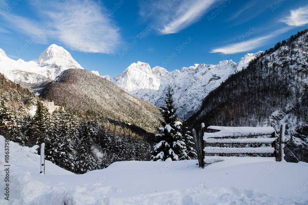 snowy winter season hayrack covered with snow in julian alps, Slovenia