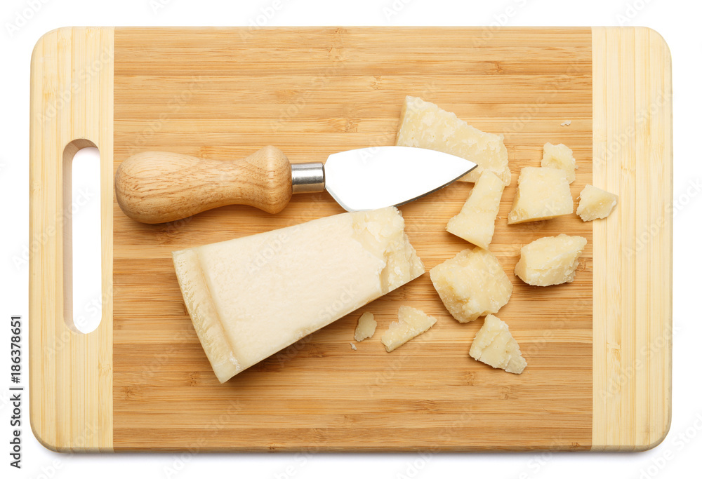 pieces of Parmesan cheese on wooden cutting board