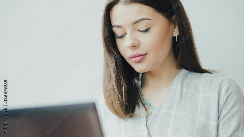 Young woman blogger working using laptop in cafe Young woman blogger working using laptop in cafe
