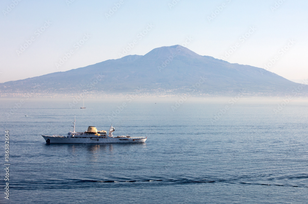 Cruise ship in Sorrento gulf with Vesuvio background during a cruise on Capri. Campania, Italy Cruise ship in Sorrento gulf with Vesuvio background during a cruise on Capri. Campania, Italy
