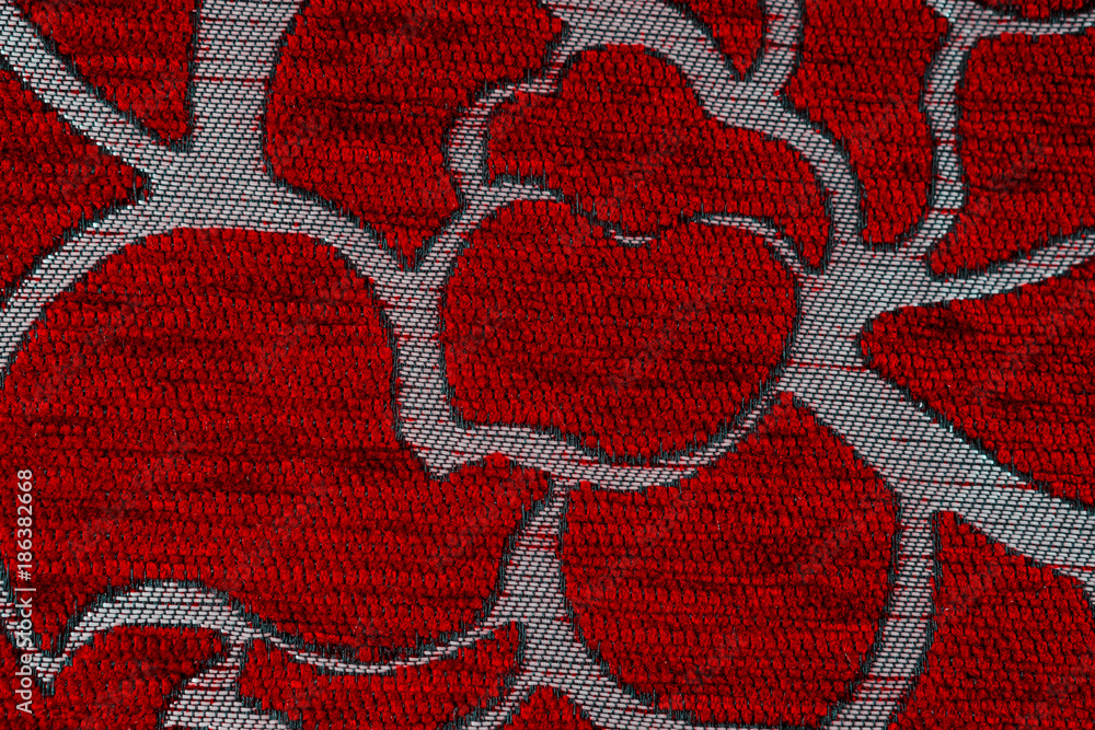 Texture of synthetic knitted fabric Shake. Red-gray, background.