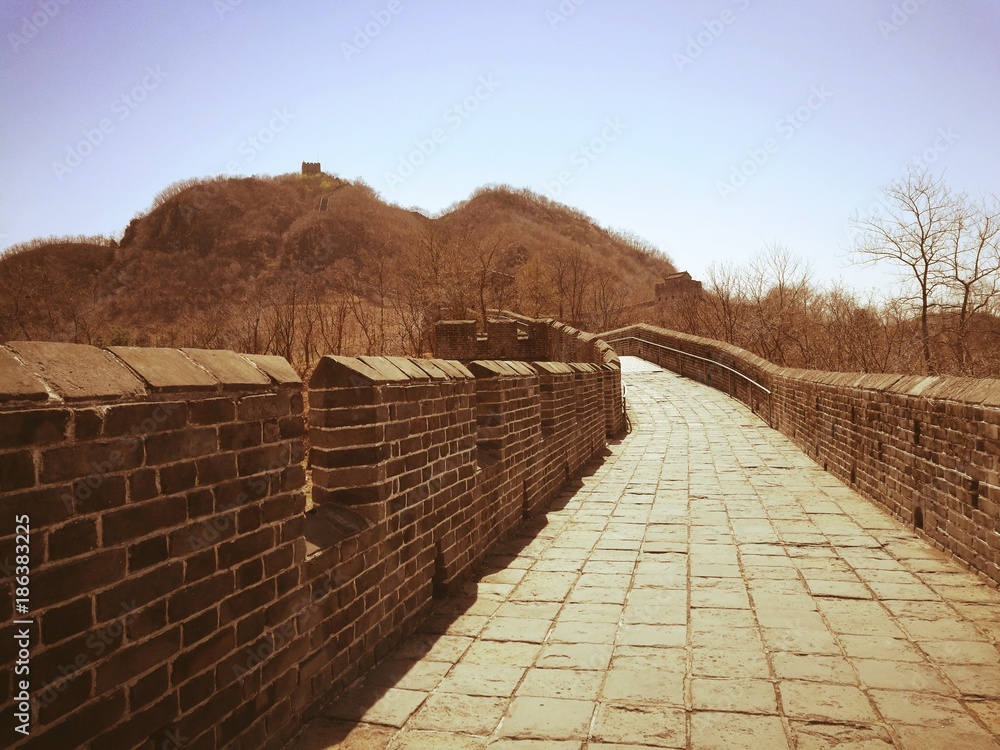 Hushan Great Wall in vintage style. It is the most eastern part of China Great Wall and located on Tiger mountain, Dandong, Liaoning; beside China-North Korea border. Top and right-bottom copy spaces.