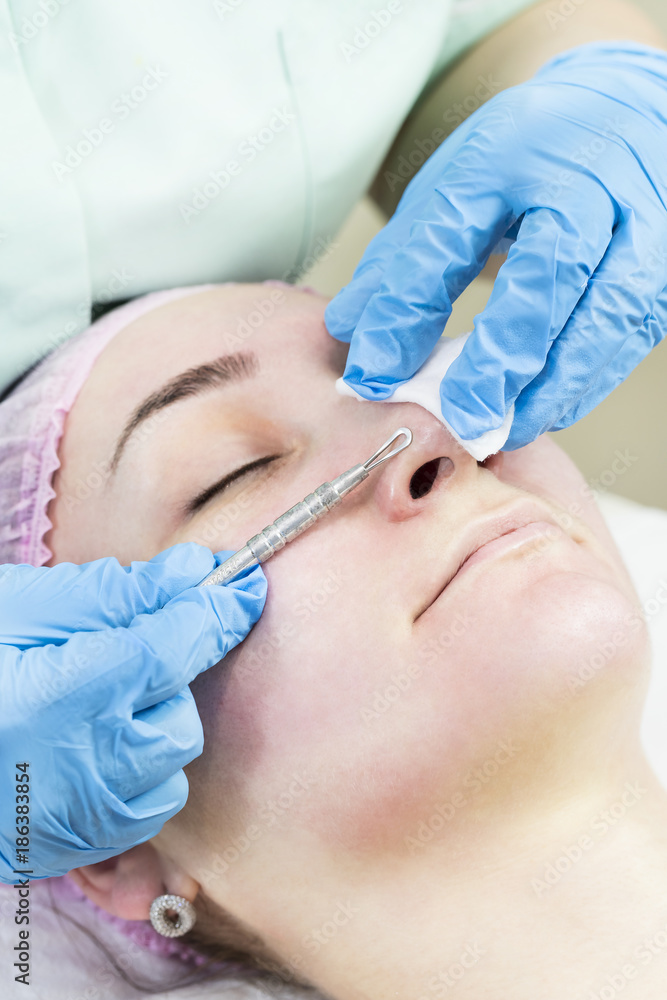 Deep cleansing of the skin on the female face with tools Deep cleansing of the skin on the female face with tools