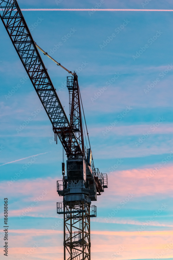 Construction crane with sunset in the background Construction crane with sunset in the background