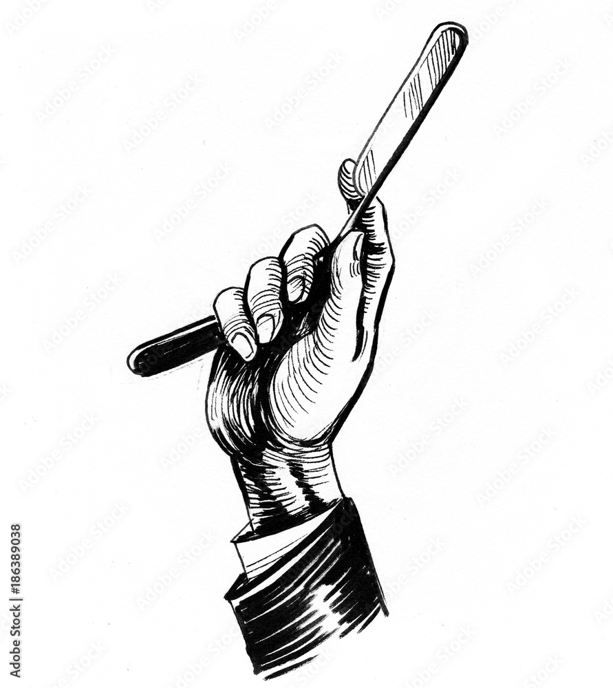 Fototapeta Barber hand holding a razor knife