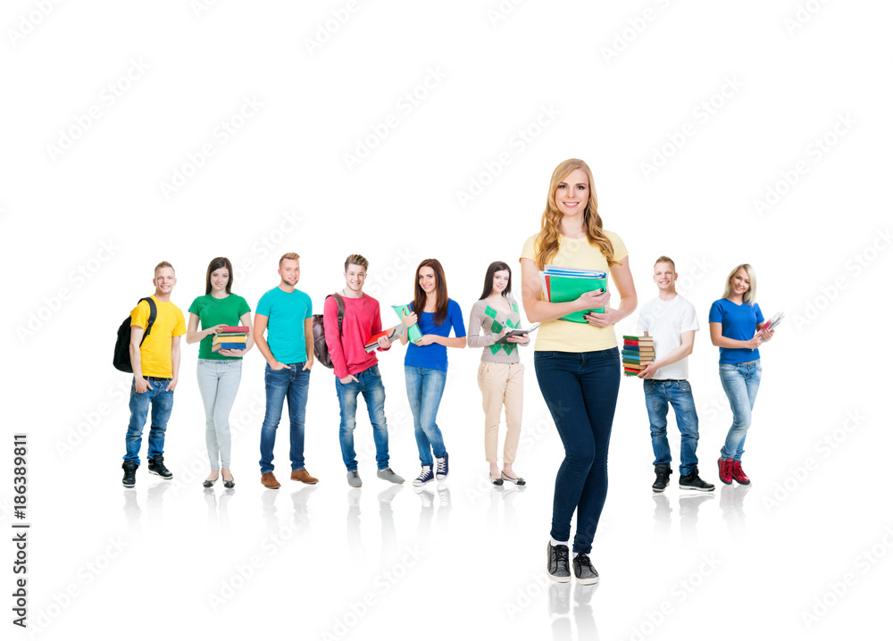 Obraz premium Large group of teenage students isolated on white background. Many different people standing together. School, education, college, university concept.