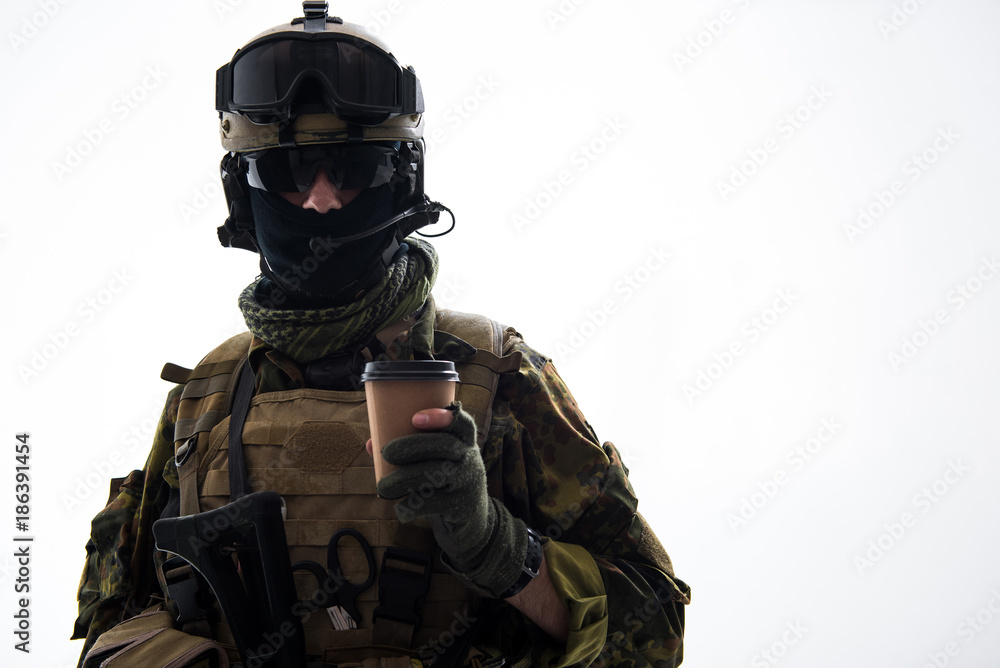 Portrait of calm defender in army uniform tasting cup of appetizing  beverage. Rest and war concept. Isolated and copy space Stock Photo | Adobe  Stock