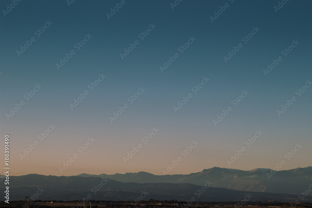Clear sky and mountains at sunset