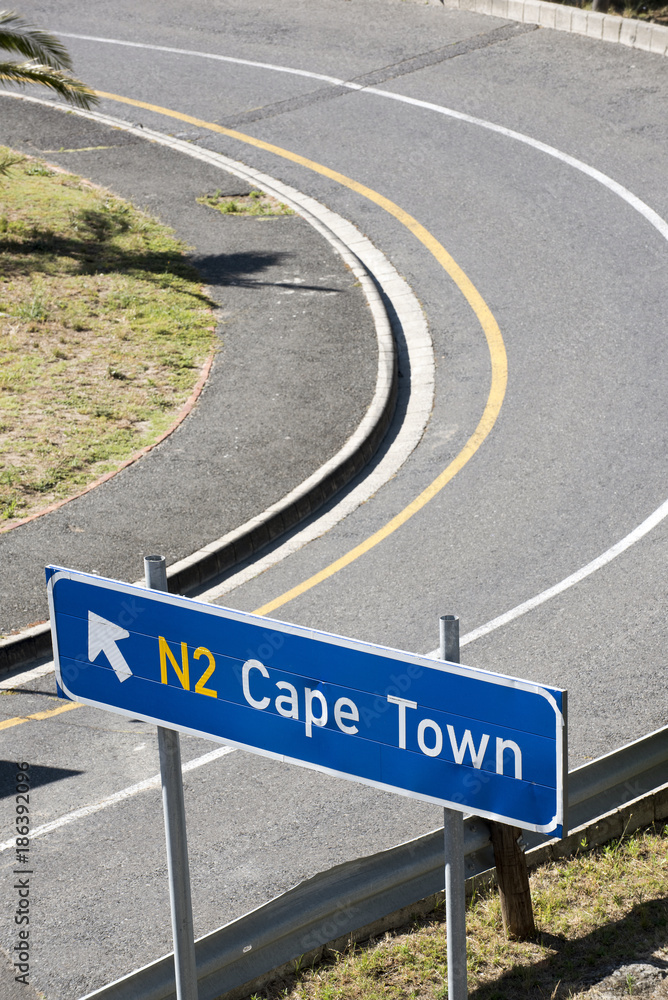 Naklejka premium Road sign pointing towards Cape Town South Africa. December 2017.