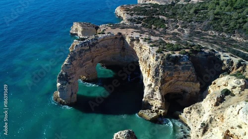 Aerial view of the beautiful Marinha Beach in Algarve, Portugal; Concept for travel in Algarve and summer vacations
