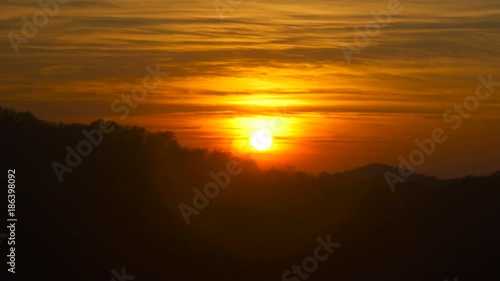 Wallpaper Mural Beautiful sunset with sun setting behind a hill and valley Torontodigital.ca