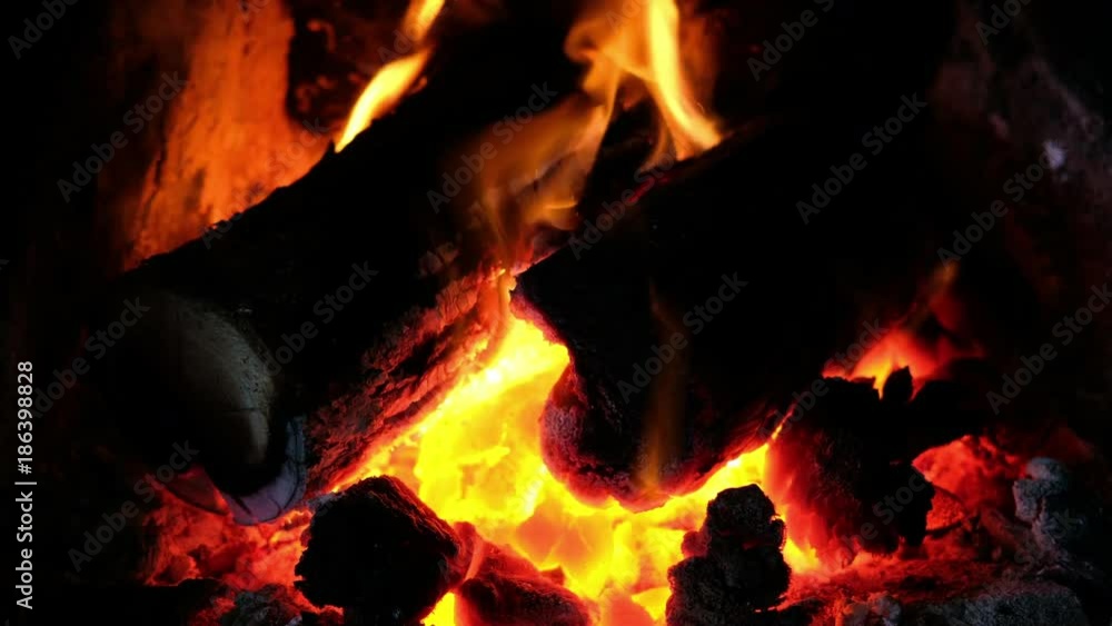 Burning coal and wood in a UK home Fireplace on a winters day. Burning coal and wood in a UK home Fireplace on a winters day.