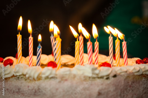 Close-up of cake and burning candles