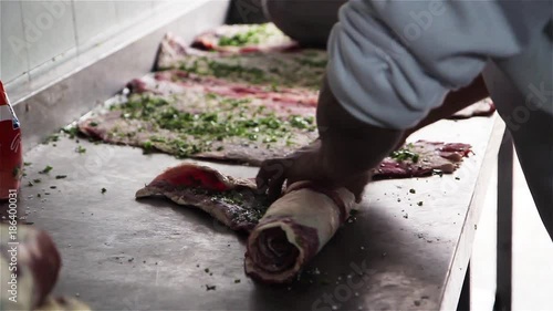 Chef making a matambre in a restaurant. Traditional food in Argentina.  photo