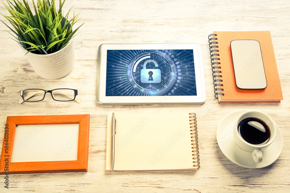 Web security and technology concept with tablet pc on wooden tab Web security and technology concept with tablet pc on wooden tab