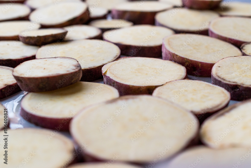 Sliced Sweet Potato Slices on Tray Sliced Sweet Potato Slices on Tray