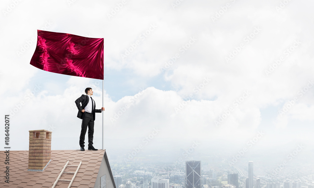 Young businessman with flag presenting concept of leadership. Mixed media Young businessman with flag presenting concept of leadership. Mixed media
