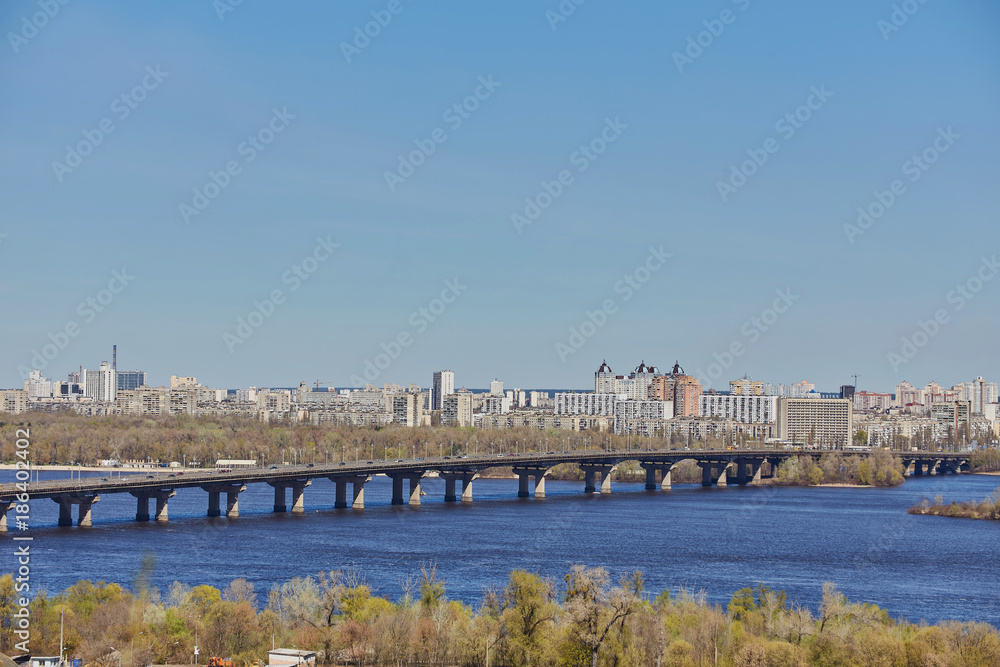 Aerial top view of Paton bridge and Dnieper river from above, city of Kiev