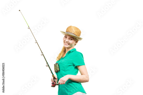 Woman with fishing rod, spinning equipment