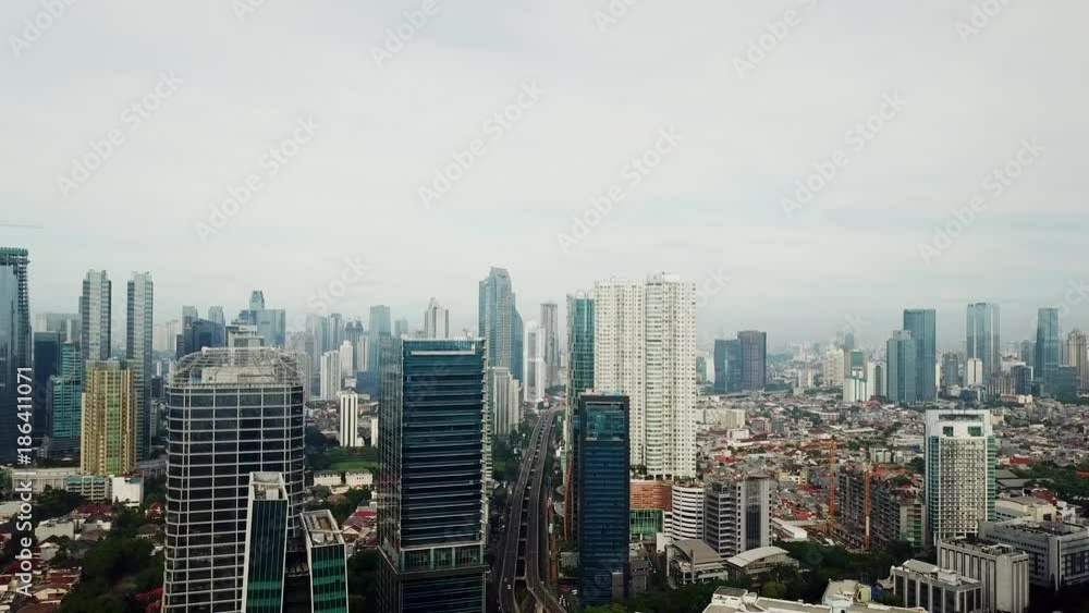 JAKARTA - Indonesia. December 22, 2017: Aerial landscape of Jakarta city skyline with skyscrapers and flyover from a flying drone. Shot in 4k resolution JAKARTA - Indonesia. December 22, 2017: Aerial landscape of Jakarta city skyline with skyscrapers and flyover from a flying drone. Shot in 4k resolution