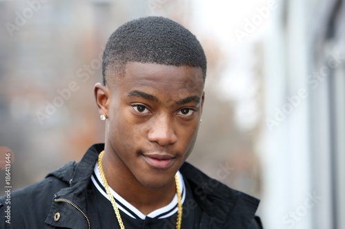 Portrait of a young African American male model in a urban setting