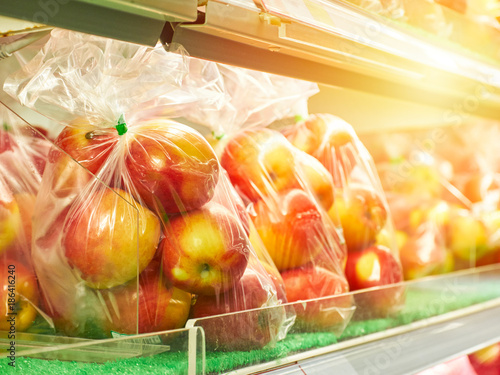 Fresh Red apples in plastic bag ready for sale in supermarket